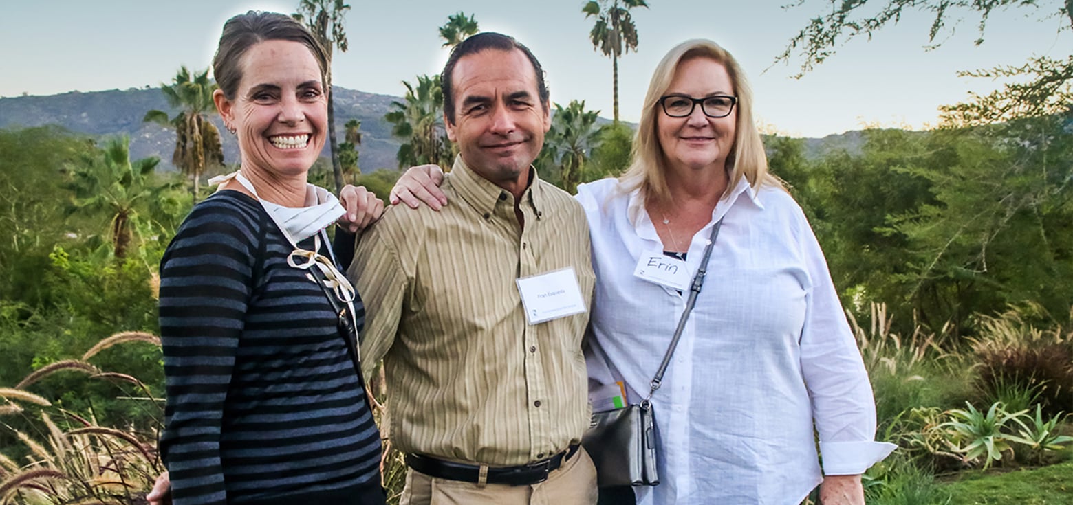 three Altman Plans employees standing side-by-side outdoors